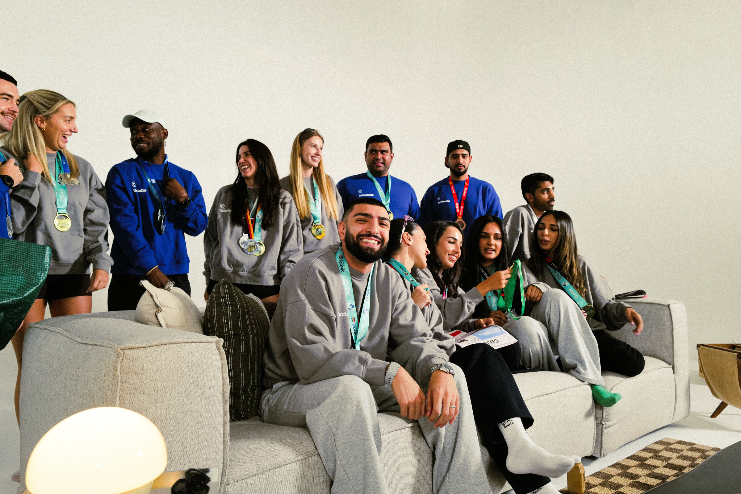 TheMarathonClub members in club sweatshirts with their race medals