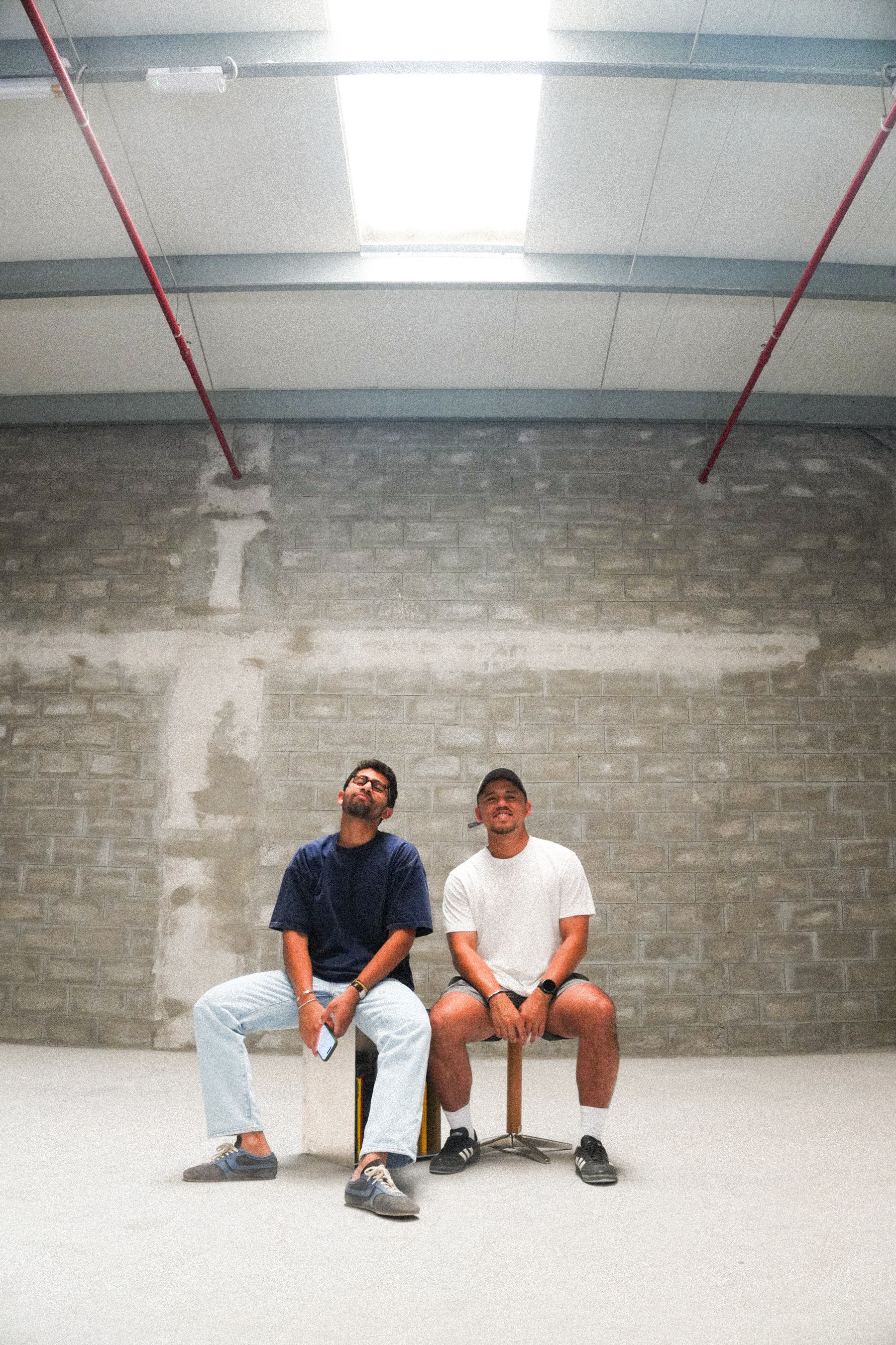 Zach and Kirk in the empty Clubhouse space